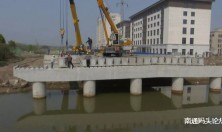 海门北海路跨圩角河桥开始桥梁吊装，预计五月底完工